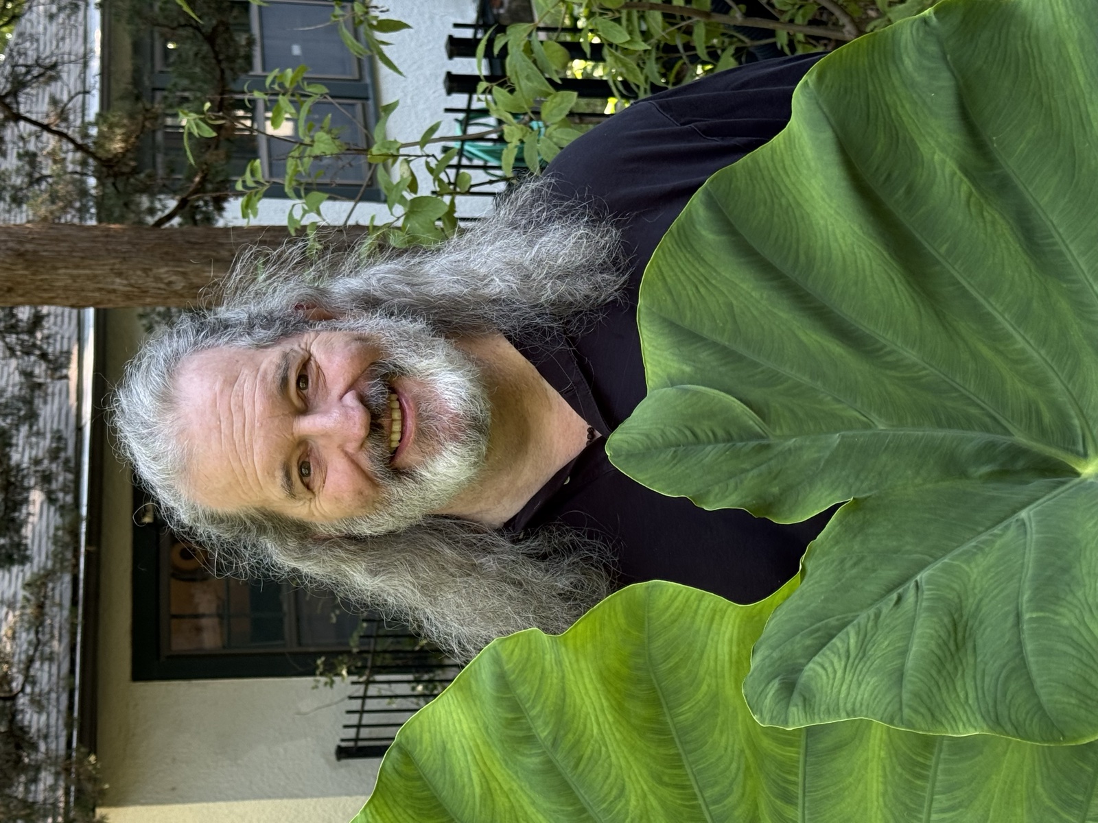 Lee Veal smiling in his garden